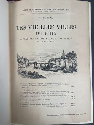 an open book with a drawing of a bridge and a river