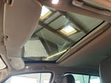 the interior of a car with a sunroof and a skylight