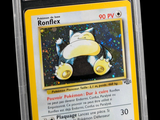 a close up of a pokemon card in a plastic holder