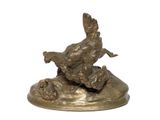 a bronze statue of a bird and a duck on a rock