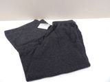 a pair of pants sitting on top of a white table