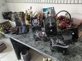 a table that has a bunch of cards and flowers on it