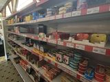 many shelves in the store with food on them