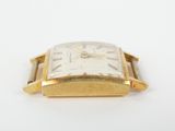 an image of a close up of a watch on a white surface