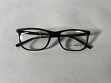 a close up of a pair of glasses on a white surface