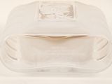 a clear glass container with a lid on a white surface