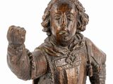bronze statue of a man with a fist in his hand
