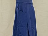 the skirt is blue and white with a small bow on it