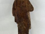 an old wooden statue of a man with a long beard