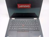 a laptop with a lenovo logo on the screen
