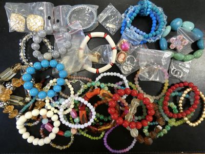 a lot of bracelets and bracelets that are on a table