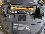 a robot that is sitting in a box on the floor