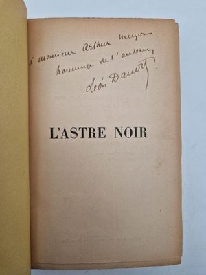 a book with writing on it sitting on a table