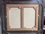 a picture of an old wooden frame with a picture in it