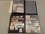 a lot of stamps on a folder on the table