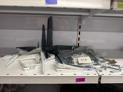 a lot of electronics on the shelves in the store