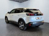 the rear end of a white car in a white room