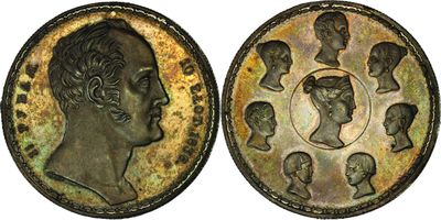 two pieces of bronze coins with heads of men and women on them