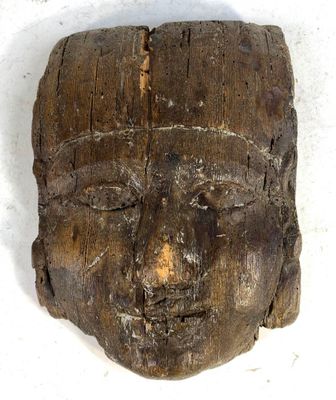 an image of a wooden head with a face carved into it