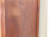 a wooden door with a brown frame on it
