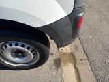 a white truck that is parked on the side of the road