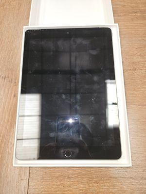 a tablet computer sitting in a box on a table