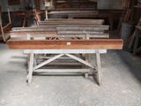 many pieces of wood sitting on a table in a room