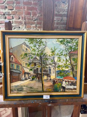 a painting of a street scene on a easel