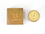a small wooden box with a picture of a man and a dog on it