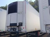 many trucks that are parked in a lot together