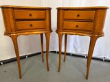 two wooden tables with drawers on them in a room