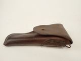 an old brown leather case with a leather handle on a white background