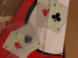 a cardboard box with some playing cards in it