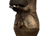 a statue of a dragon on top of a vase
