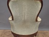 a chair with a wooden frame and upholstered seat