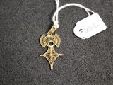 a close up of a necklace with a tag attached to it