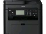 a canon printer with a scanner on top of it