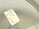 a piece of paper in a pot of water