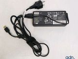 the charger is plugged into the laptop and plugged into the charger