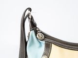 a purse that has a blue and yellow lining on it