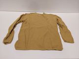a brown shirt sitting on top of a white table