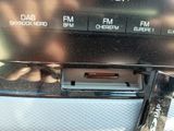 a close up of a car dashboard with a remote control