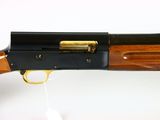 a close up of a rifle on a white surface