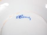 a white plate with a blue writing on it