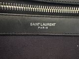 a close up of a black bag with a zipper on it