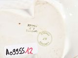 a close up of a plate with a sticker on it