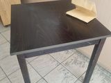 a small table with a piece of paper on top of it