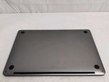 a laptop computer sitting on top of a white table