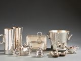 many different silverware items sitting on a table