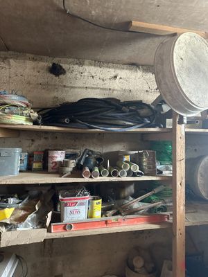 a room with a lot of items on the shelves
